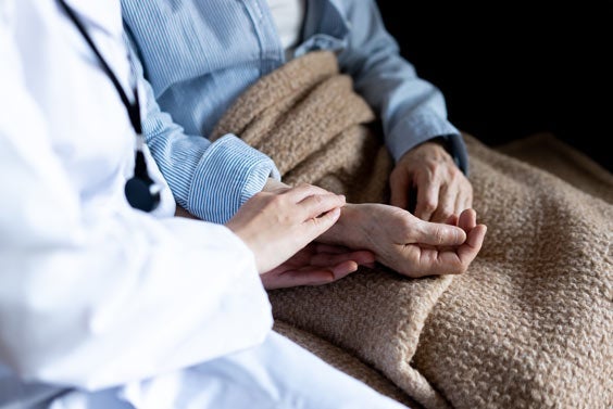 Home nurse taking care of patient