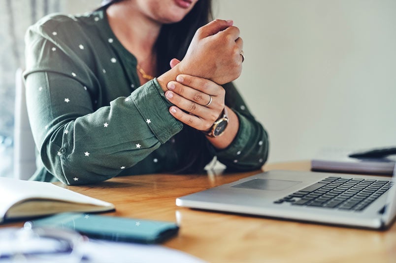 Woman holding wrist